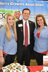 Representative Jake Raburn with Florida Strawberry Growers Association Ambassadors Morgan and Miranda.